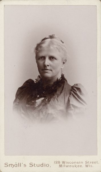 Carte-de-visite of a vignetted quarter-length studio portrait of Mary Ilsley Brigham (1838-1894). She is wearing a dark dress with lace on the collar.