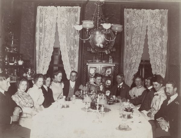 Mrs. Nina Dousman with children and house party guests in the dining room at Villa Louis.
