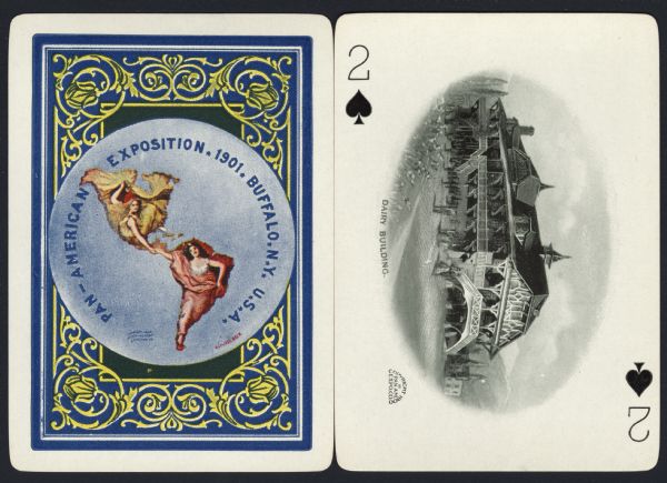 Souvenir playing card out of a full deck from the Pan-American Exposition. The Two of Spades displays a drawing of the "Dairy building," a large ornate barn-like building with many ethnic embellishments. Over the main door, an arced staircase leads up to a second floor balcony that circles the building. In the background are trees and hills. People are standing on the lawn in front of the building. On the reverse is the official logo for the Pan-American Exposition in full color, with an ornate border.