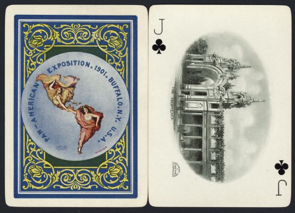Souvenir playing card out of a full deck from the Pan-American Exposition. The Jack of Clubs displays a drawing of "The Propylaea," a large cathedral like building with two steeples. (A proplaea is the structure forming the entrance to a temple.) Between the steeples is a large arch. Columns support the second story which has greenery growing on it. In front of the main gate and along the side is a lawn area with pedestrians walking about. On the reverse is the official logo for the Pan-American Exposition in full color, with an ornate border.