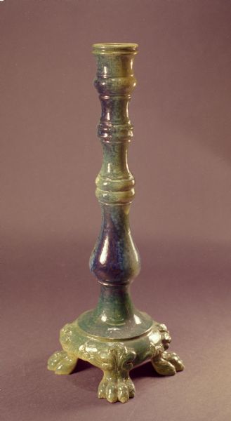Pauline pottery candlestick with clawfoot base.