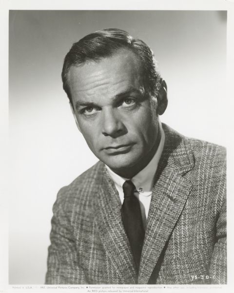 Publicity photograph of James Daly for the RKO film <i>The Young Stranger</i>. He is wearing a suit coat, dark tie and white shirt.