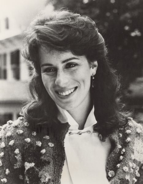 Promotional photograph of Jane Kaczmarek for the television show <i>Hometown</i>. She is wearing a sweater and a blouse, earrings and a collar pin.