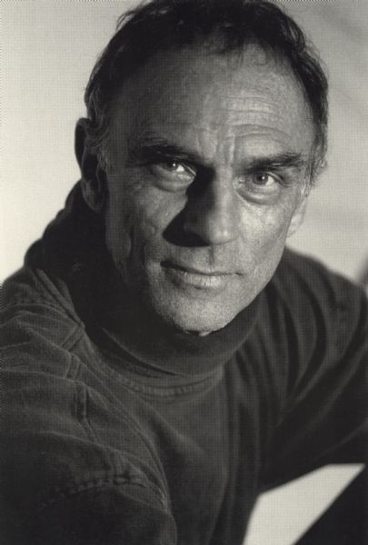 Quarter-length publicity portrait for the actor Marc Alaimo. He is facing the camera but his body is slightly turned to the side.