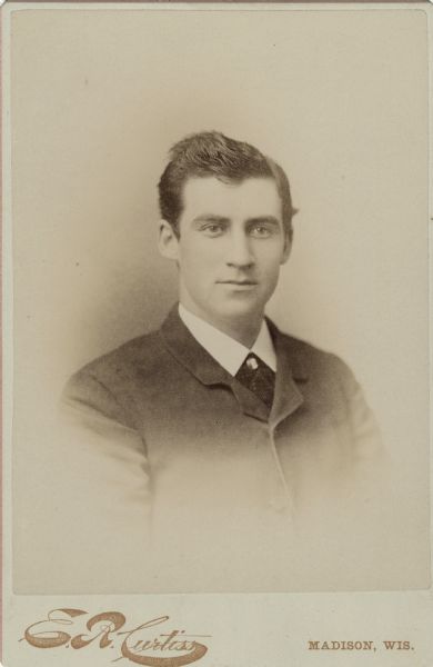 Quarter-length, formal studio portrait of George S. Parker of Janesville, Wisconsin.