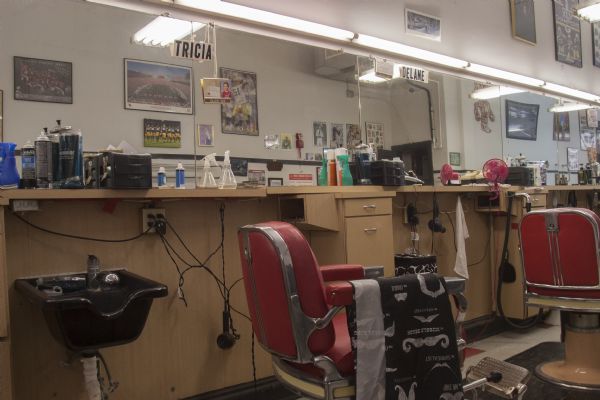 The last week of business at the College Barber Shop. Interior of shop showing employee's work stations.