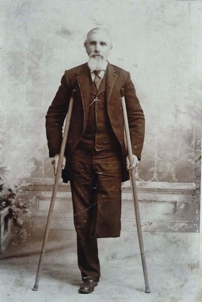 Jacob Witting, Jr., was born January 15, 1837 in Renhoff, Prussia. He was a soldier in the Iron Brigade during the Civil War. Jacob is posing standing with his crutches in front of a painted backdrop. He lost his leg as the result of a wound during a battle. He died in 1890. The Iron Brigade, a unit comprised of soldiers from Wisconsin, Indiana, and Michigan was known for its determined fighting ability.