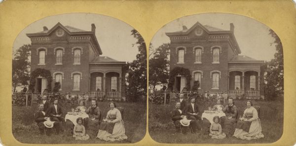 "Rev. N. Brandt and family, Decorah, Iowa" from Dahl's 1877 "Catalogue of Stereoscopic Views." Nils Olsen Brandt was born in Valdres Norway in 1824 and died in 1921. He was a pastor in Decorah from 1865 to 1882 and a teacher at Luther College.