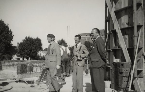 Frank Lloyd Wright, Mies Van Der Rohe, and others at the Johnson Wax building construction site.