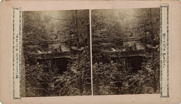 Stereograph of a scene at Pewit's Nest. Text on front reads: "Wisconsin Views, Devil's Lake."