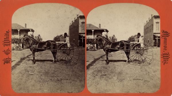 Stereograph of a man in a two wheeled cart drawn by one horse. He is stationary, posing in the street. In the background are buildings on both sides of the street. A sign on the building to the right reads, in part: "Cash for Butter" and "GR?" Signs farther back read: "Harness" and "Shoeing & ?" The building on the left may be a hotel.