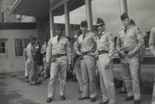 Lewis Arms (fourth from right) waiting with other soldiers to leave for Fort McCoy.
