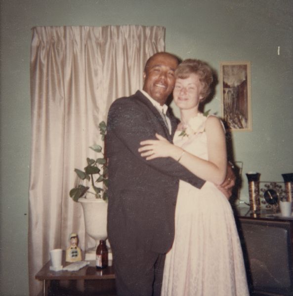 Lewis and Janet Arms embracing on their wedding day. They are at the home of Nedra Arms at 542 North Street.