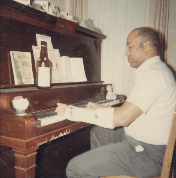 Lewis Arms Playing Piano Photograph Wisconsin Historical Society