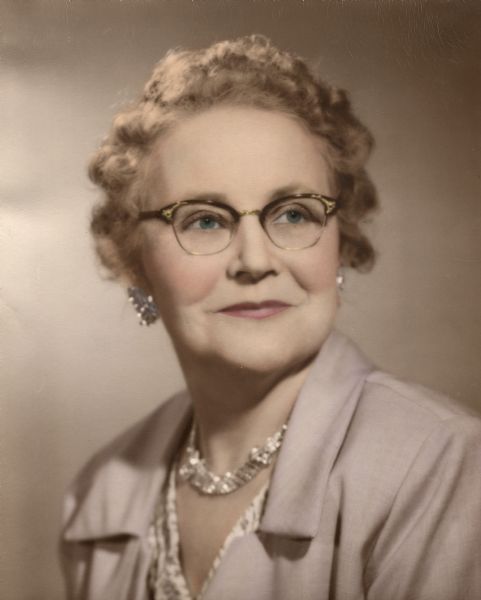 Quarter-length studio portrait of Ruth S. (Johnson) Shuttleworth. Ruth worked as a stenographer at the State Historical Museum from 1917 to 1946, an assistant to Dr. Charles E. Brown, Director of the Museum from 1908 to 1944. Her sister, June, worked at the State Historical Society of Wisconsin as a librarian from 1948 to ca. 1980.
