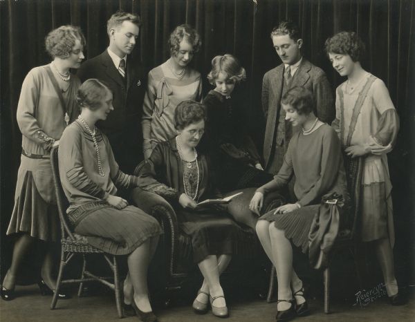 Formal group portrait of the Hannah Johnson Family. In the front are (l to r) Maude, Hannah (mother) and Marguerite. In the back are Ruth, Ozzie, Mildred, June, Allan and Mabel. Hannah's daughter, Ruth S. (Johnson) Shuttleworth, worked as a stenographer at the State Historical Museum from 1917 to 1946, an assistant to Dr. Charles E. Brown, Director of the Museum from 1908 to 1944. Another daughter, June E. Johnson, worked at the State Historical Society of Wisconsin as a librarian from 1948 to ca. 1980. Her son, Allan, worked on a CWA archaeology survey for Charles E. Brown in 1934. The parents were Swedish immigrants, though all of the children were born in the Midwest. The children's father, Frank A. Johnson, died in 1919.