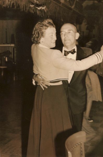 Harry Lynde Bradley, and his wife Margaret "Peg" Blankney Sullivan Bradley, dancing at a party.