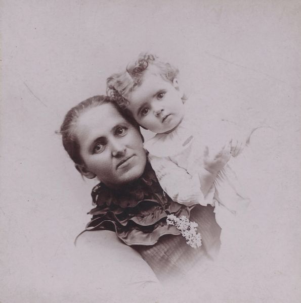 Formal quarter-length portrait of Ettina Mae Perry Franklin, and her daughter Ida Belle Franklin. Ettina was married to Jerome Francis Franklin Sr. Ida married Grover Thomas Strong, and may have gone by Belle Franklin-Strong in adulthood.