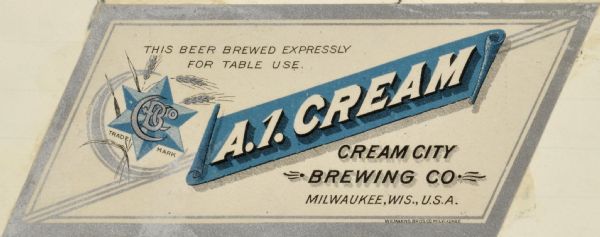 Label submitted to the state of Wisconsin for trademark registration. In the center of the label, cut in the shape of a parallelogram, is a blue banner with the words "A.1. Cream." The label has a metallic silver border and the logo for Cream City Brewery, which includes a star, crescent moon, shafts of wheat, and the letters CCBO.