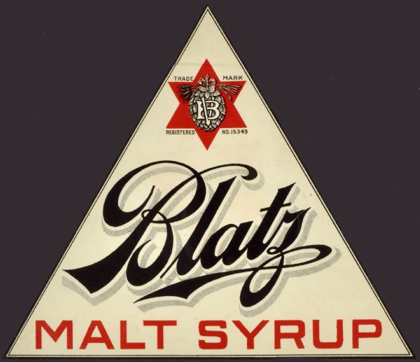 Label submitted to the state of Wisconsin for trademark registration. The triangular shaped label for Blatz Malt Syrup is printed in black and red. At the top of the triangle is the trademark for the Blatz Brewing Company, which features a red six pointed star in which there is a hop flower, stalks of barley, and the letters VB.