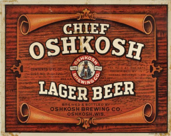 Label submitted to the state of Wisconsin for trademark registration. "Chief Oshkosh, Lager Beer, Brewed and Bottled By the Oshkosh Brewing Company." Printed on the label is a wood grain background and the logo for the Oshkosh Brewing co. which features an image of a Native American, labeled Chief Oshkosh.