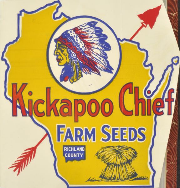 Label submitted to the State of Wisconsin for trademark registration. Features the shape of the state of Wisconsin outlined in blue and filled in with yellow. The silhouette of an Indian Chief is in a circle above the words, "Kickapoo Chief Farm Seeds, Richland County." A shock of wheat is in the bottom right corner, and behind the design is a red arrow with an arrowhead.