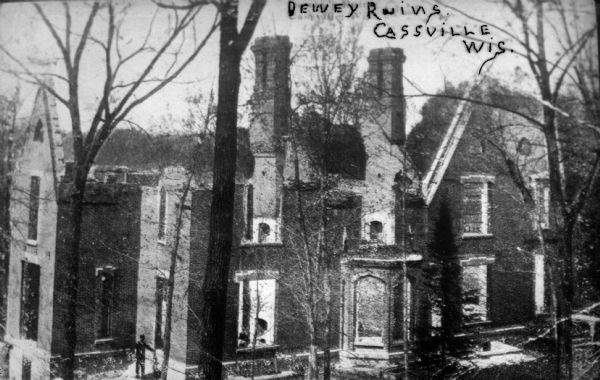 Elevated view of the ruins of the Nelson Dewey home. The house burned in 1873. A man is standing near a door or window on the bottom left.