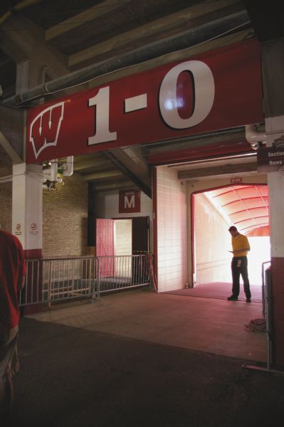 The 1-0 Tunnel at Camp Randall Memorial Stadium. Above the tunnel's doorway, a small red sign reads: "Eat a rock."
