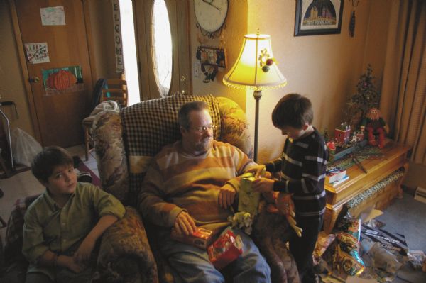 Robert “Rocky” Skifton with his grandson Christopher Roberts (right) and son Danny (left) on Christmas.