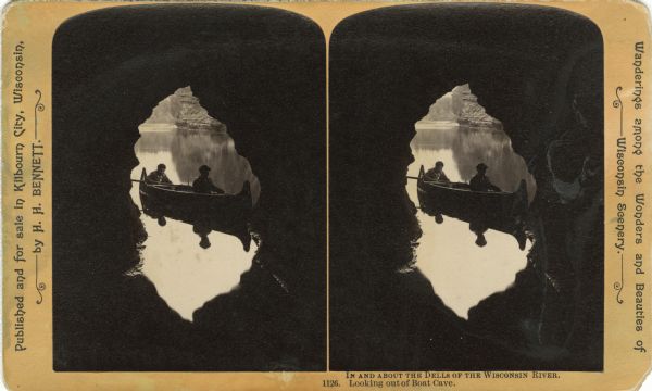 Stereograph from within a cave towards two men in a canoe. Text at right: "Wanderings Among the Wonders and Beauties of Wisconsin Scenery."