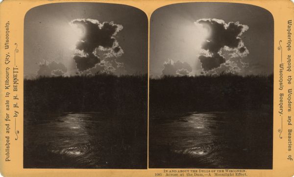 Sunlight shining through a cloud, illuminating the water below. "Text at right: "Wanderings Among the Wonders and Beauties of Wisconsin Scenery."