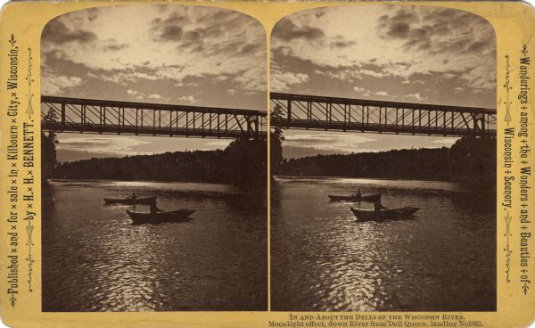 Two boats under a bridge on the Wisconsin River. "Text at right: "Wanderings Among the Wonders and Beauties of Wisconsin Scenery."