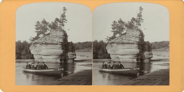 View from shoreline of George and Nellie Crandall with two men on their boat "Bessie" at Sugar Bowl.