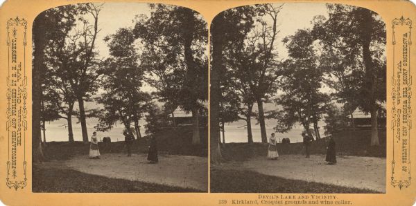 A game of croquet between two women and a man. There is a building on the right, and a body of water in the background. Text at right: "Wanderings Among the Wonders and Beauties of Wisconsin Scenery."