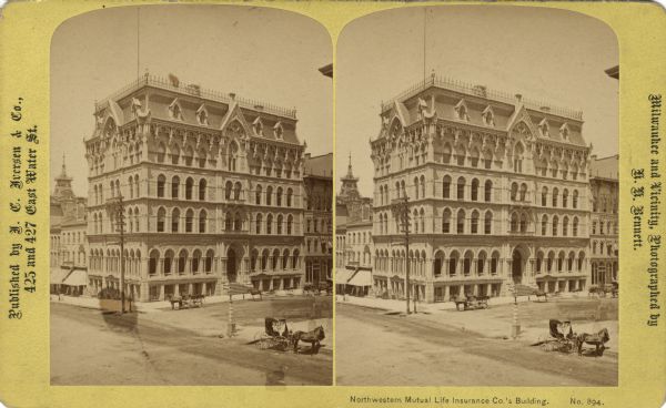 Elevated stereograph of the Northwestern Mutual Life Insurance Company Building on Broadway Street and Wisconsin Avenue. Horses and carriages are on the unpaved street. Text at right: "Milwaukee and Vicinity, Photographed by H.H. Bennett."