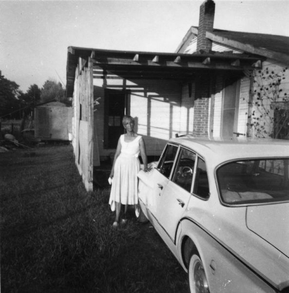 Mrs. Addie Mae Jackson stands in front of her home where Sandra Adickes stayed while volunteering during the Freedom Summer project.