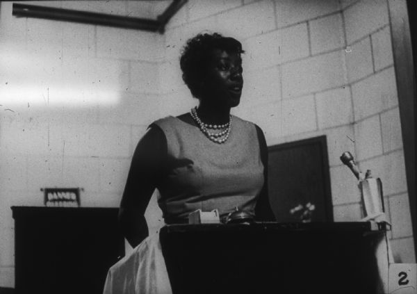 A woman identified as Unita Blackwell speaks before an audience at a Mississippi Freedom Democratic Party (MFDP) function.