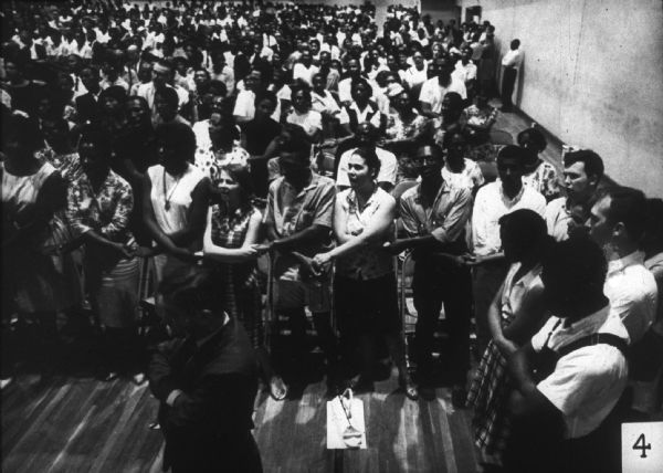 An integrated group sing-along at a Mississippi Freedom Democratic Party (MFDP) function.