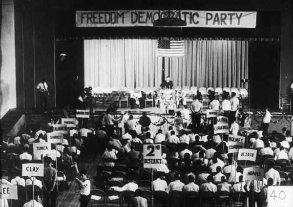Audience and stage with a banner that reads "Freedom Democratic Party" at the Mississippi Freedom Democratic Party (MFDP) State Convention.
