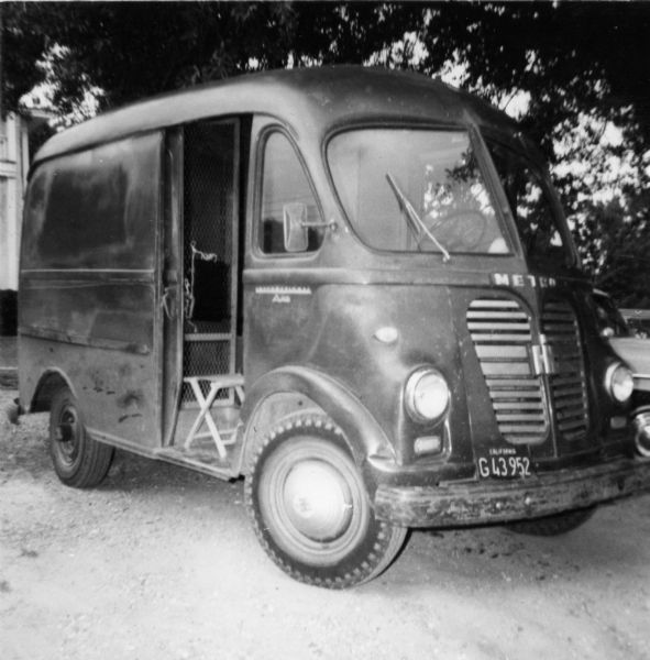 International Harvester Metro parked outdoors photographed by a civil rights volunteer. "Delta Ministry Express - 80 m.p.h. trip from Hattiesburg to Edwards (Mt. Beula) on the way to McComb. Mt. Beula was a training center for Head Start teachers and other freedom activities that required large feeding and sleeping facilities. The families of the cotton strikers of Greenville were housed here for a while."