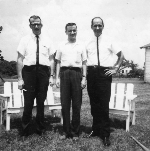 Group portrait of three ministers taken by a civil rights volunteer.

"Ned Gillam, Disciple of Christ minister, Fairfield, Iowa, was denied admittance to the Disciple of Christ church in McComb after it became known that he was working for the Delta Ministry. Known members of the Ku Klux Klan belonged to this church. The other two ministers were quietly active in trying to bring white businessmen, clergy, etc., into a dialogue of concern in McComb. These two men also visited Natchez a few days in order to ascertain what value the Delta Ministry could have. Their report was a negative one since Negroes of Natchez were at that time not working together."