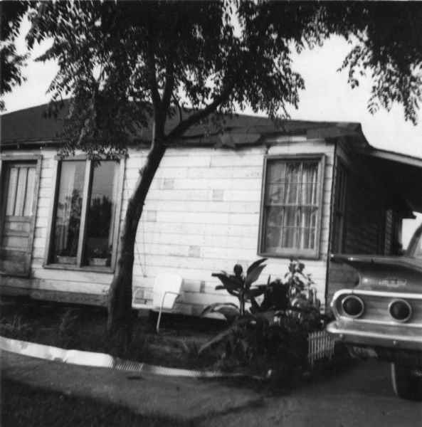 View of a home taken by a civil rights volunteer.

"Mrs. Quin's home.  The section to the right of the tree shows the new bedroom, rebuilt after it was bombed last summer."