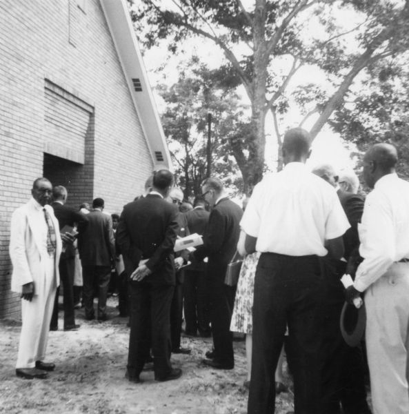 Image of a church dedication service taken by a civil rights volunteer.<p>"Church dedication — Society Hill Baptist Church — most of these people are ministers who led us into the church."