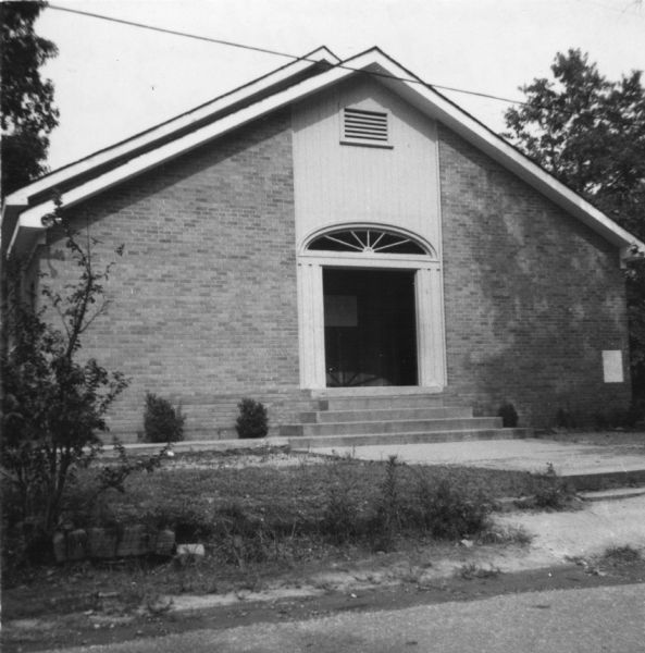 A church building photographed by a civil rights volunteer.<p>"The 4th Sunday church of Summit. Rev. Ned Taylor, pastor. After church, Rev. Taylor invited Steve Barber and me for a delicious Sunday dinner.  Rev. Taylor is also pastor of the bombed Society Hill Baptist Church (McComb). We purposely went to the Negro churches on Sundays because we worked in the Negro sections during the week. For the older Negroes, the fight for freedom and their deep religious faith are rarely separated."