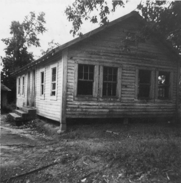 A rural schoolhouse photographed by a civil rights volunteer.<p>"A Negro school located outside Gillsburg, Miss. Photographed on our trip to return two MFDP (Mississippi Freedom Democratic Party) workers to their 'home' in Amite County - an area of increasing bitterness and tension."