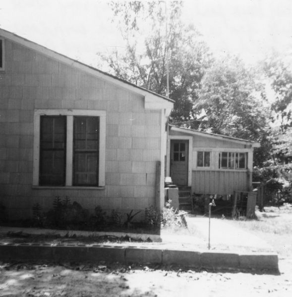 Rear view of the home of Mrs. Thompson, who hosted civil rights volunteers in her house.<p>"Back part of Mrs. Thompson's house. Large fan in the kitchen window proved to be an efficient air conditioner."