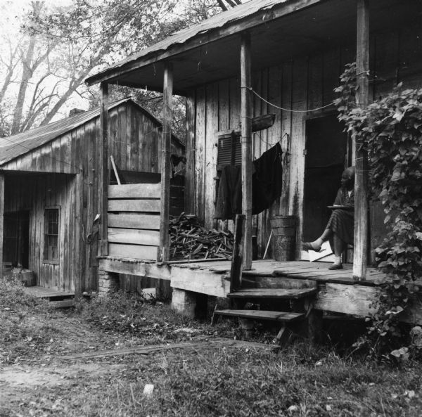 "Woodpile on porch. Dangerous steps and porch. Boards layed [sic] over mud for front walk. Two persons have one room each in their building.  Ages 50 and 73. $7.00 per month rent each. They draw water across the street from an outdoor faucet shared by 5 families and 11 persons. The outhouse in back is shared by four older persons in separate households."<p>Beekman Quarters housed 81 people in 23 buildings. None of the houses in the neighborhood had running water or gas/electric heating; the neighborhood had 15 outdoor toilets and 11 outdoor water hydrants.