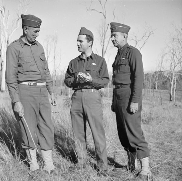 Civilian war correspondent Robert Doyle interviewing Major General William Hanson Gill (left), and Lieutenant General Robert L. Eichelberger (right), at Camp Cable, near Brisbane, Australia. General Gill was the commander of the 32nd "Red Arrow" Division and General Eichelberger commanded American infantrymen in the Papuan campaign.