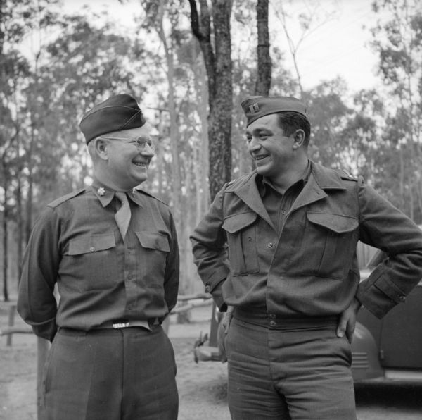 Lieutenant Colonel Philip F. La Follette and Captain William Kurkeet, of Madison, Wisconsin, chatting at Camp Cable, near Brisbane, Australia. La Follette was the 27th (1931 to 1933) and 29th (1935 to 1939) Governor of Wisconsin. When war was declared, he joined the U.S. Army serving on the staff of General Douglas MacArthur.