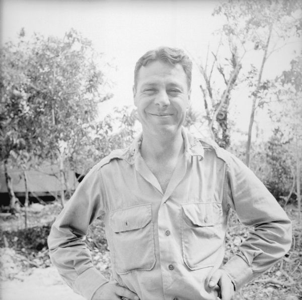Major Howard Pagel of Ladysmith, Wisconsin, poses for a photo on Kiriwina Island in the Solomon Sea, New Guinea (present day Papua New Guinea). Notes by Robert Doyle, "Engr. Reg., Regimental Surgeon, APO 928 - Reserve officer in Mar. 17, 1941. Sailed Jan. 13, 1942 - Arr. Melbourne - Townsville area & Iron Range - Much air corps work - Roads & strips - Arr. Moresby, Nov., 1942."